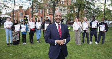 Mayor of Tower Hamlets, Lutfur Rahman, standing in front of his canvassers and supporters in a park