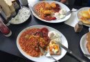 Classic full english breakfast, with egg, beans, tomatoes, toast and hash browns