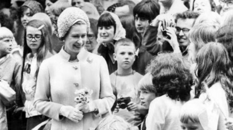 Queen Elizabeth in a crowd of children at Victoria Park, East London, in 1977