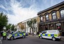 Police cars outside Lord Tredegar pub on Lichfield Road, Bow, East London, investigating Shea Gordon's murder.
