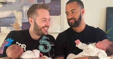 Roony Keefe and Jason Balfourth, hosts of Couple of Dads podcast, holding their babies