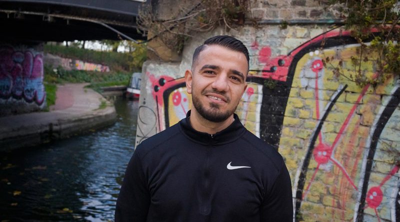 Mustafa Has standing by a canal in Old Ford, East London
