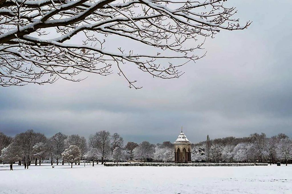 Coutts tower in snowy Victoria Park, East London, December 2022.