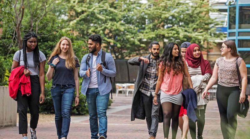 Queen Mary University students walking on Mile End campus.