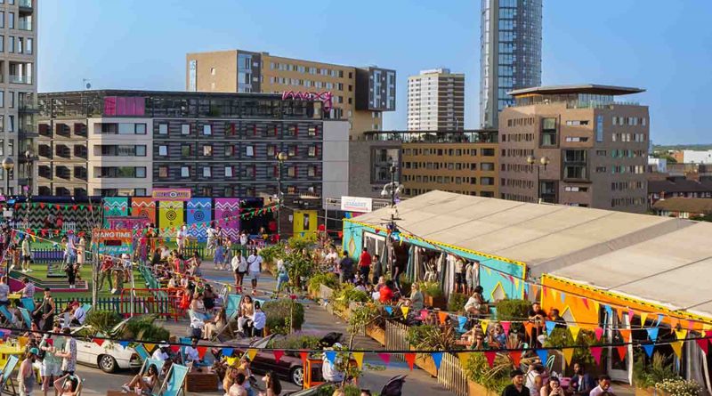 A large and busy rooftop with stalls for restaurants, bars, and actvities such as crazy golf.