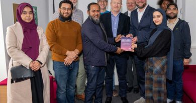 Nurull Islam, co-founder of Mile End Community Project, receiving a 'Local Hero' award from Community Fibre broadband provider.