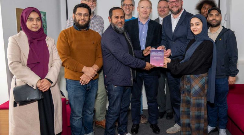 Nurull Islam, co-founder of Mile End Community Project, receiving a 'Local Hero' award from Community Fibre broadband provider.