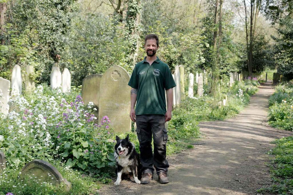 Keith and Hunter, dogs and their owners at Tower Hamlets Cemetery Park, East London.