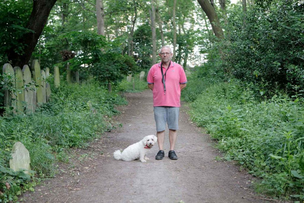 Mark and Casper, dogs and their owners at Tower Hamlets Cemetery Park, East London.