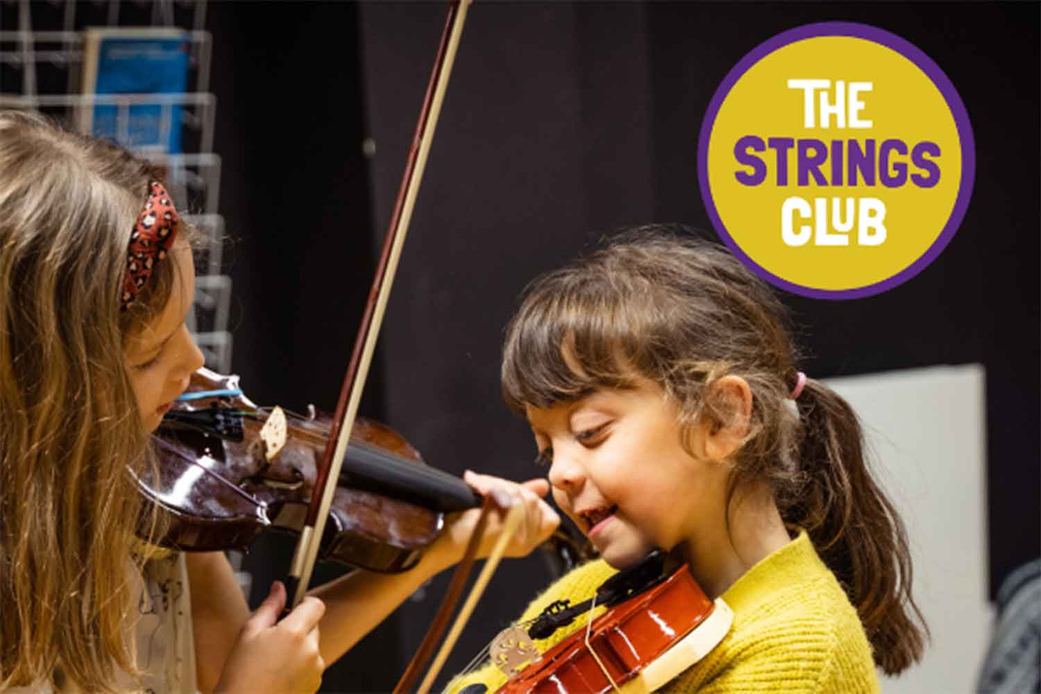 Children learning the violin at The Strings Club summer camp, East London