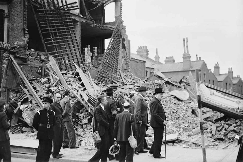 Winston Churchill visiting bomb damaged areas of East London during World War II.