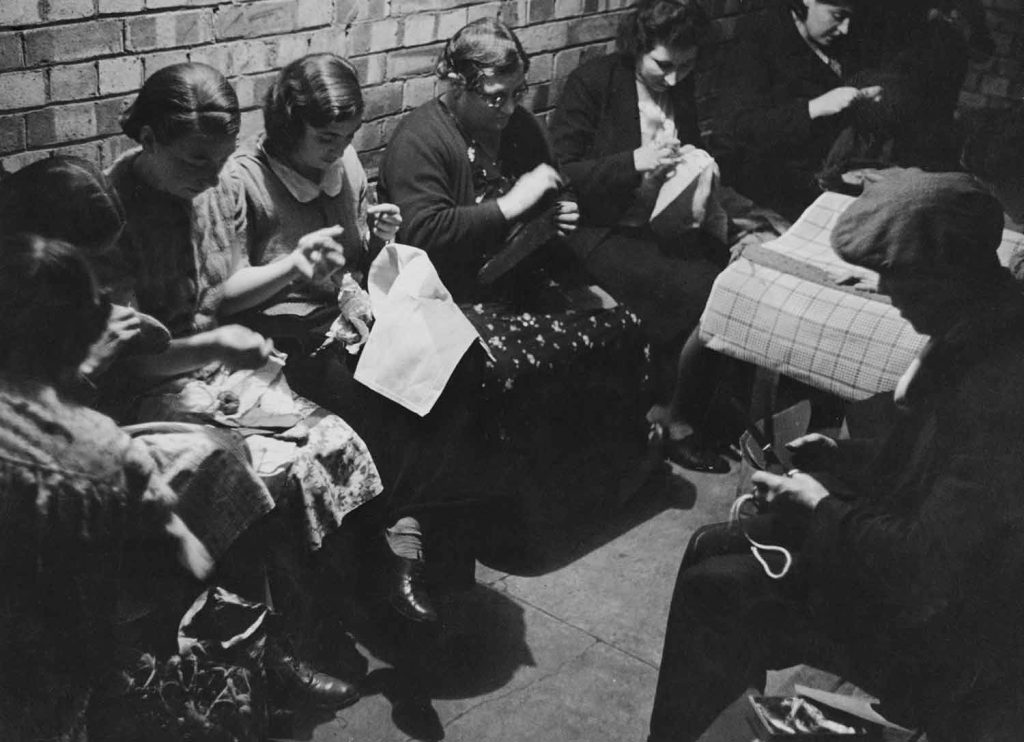 Women sewing at Shelter Committee in Spitalfields in 1941: Images of Housing, Homelessness and Resistance in London's East End, from the Conditions of Living exhibition at Four Corners.