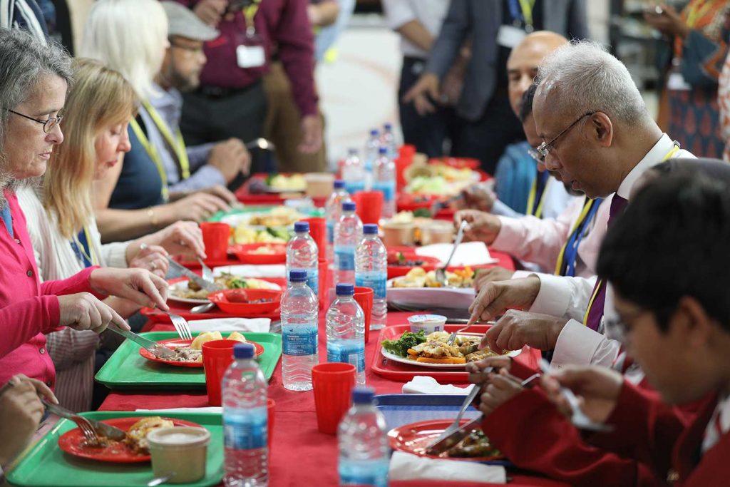 Mayor Rahman eats school lunch with pupils and teachers at Swanlea School.
