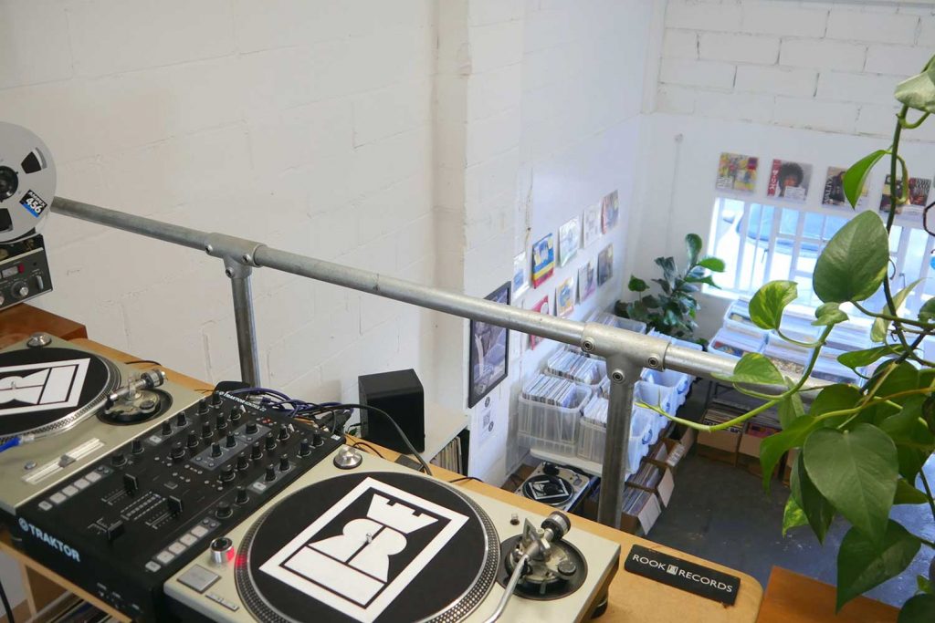 Interior of Rook Records vinyl shop from mezanine level with turntables in Hackney Wick.