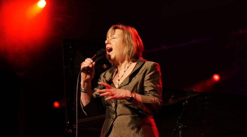 Jazz musician Norma Winstone singing on stage.
