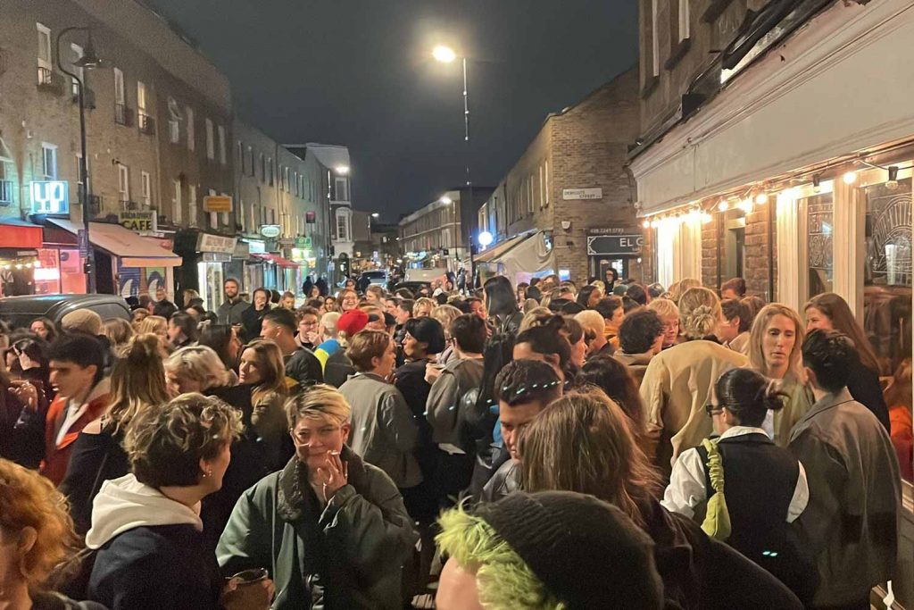 Crowds of people outside La Camionera lesbian night on Broadway Market, East London