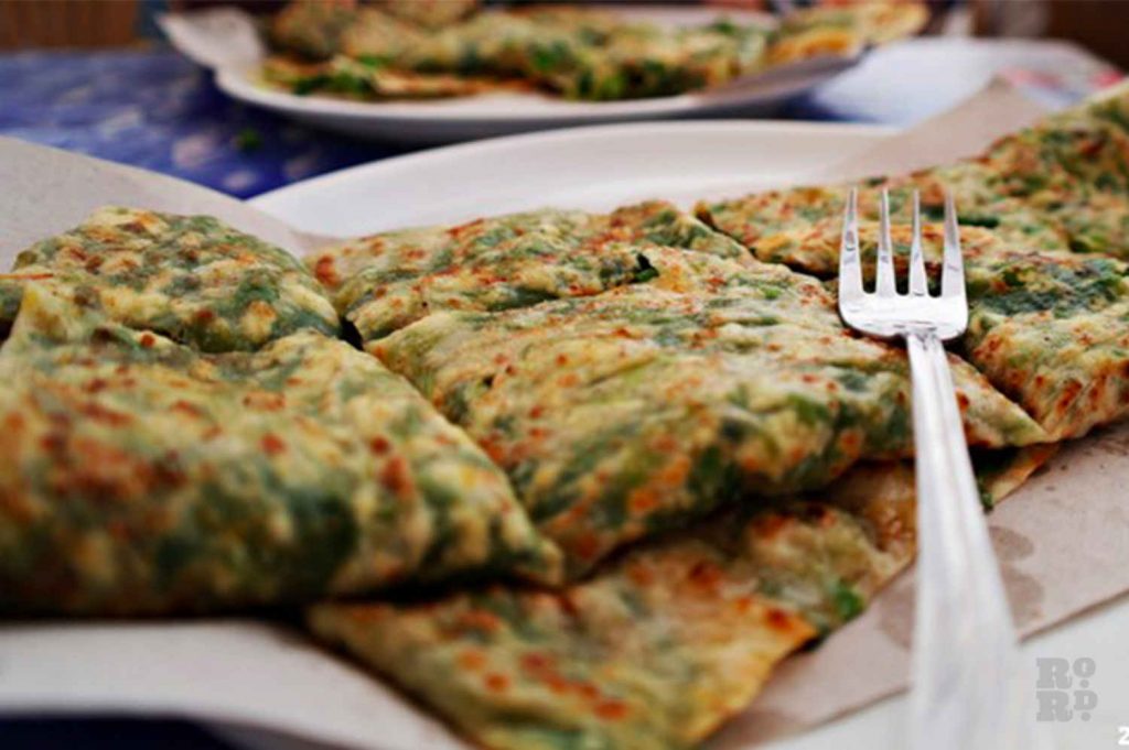 Spinach Gozleme with a fork ontop served at Gozlemes at Artisan Bakery, Usher Road, Bow, East London