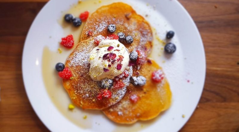 Pancakes topped with cream and berries served at 90 degree melt, Mile End, East London