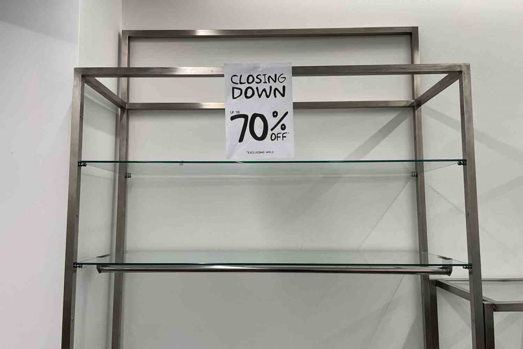 70 percent off signs at Zee and Co closing down event, Roman Road, East London