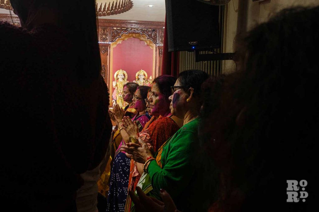 Women celebrating Holi Day festival, or Dolyatra, at the Hindu Pragati Sangha in Mile End, East London.