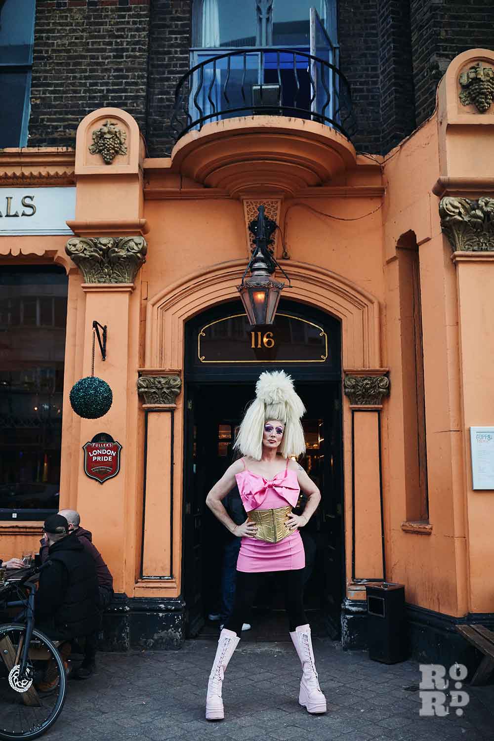Christina Draguilera outside The Bow Bells Pub entrance
