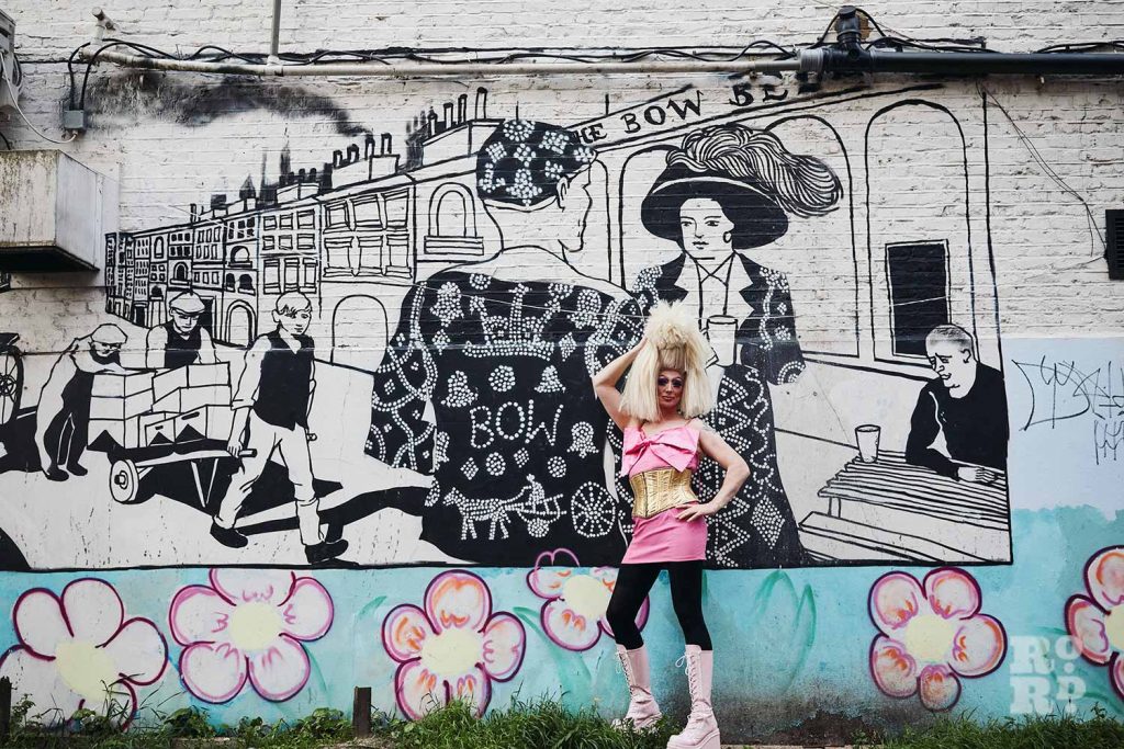 Christina Draguilera in front of the Pearly Kings & Queens mural on Bow Road