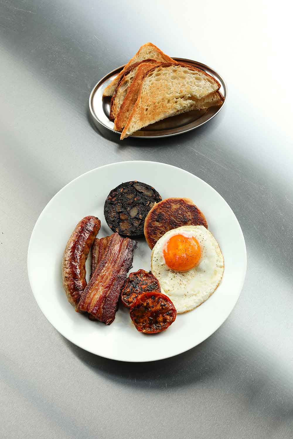 Full Irish with hand-cut belly bacon, traditional black and white pudding, eggs and toast at INIS, a new eatery opening in Hackney Wick