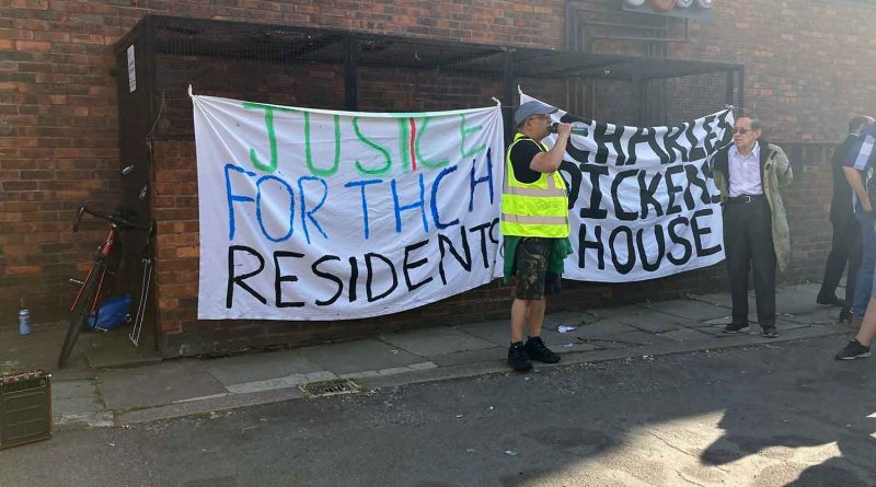 Tower Hamlets Community Homes residents protesting with a banner against the proposed merger with Poplar HARCA