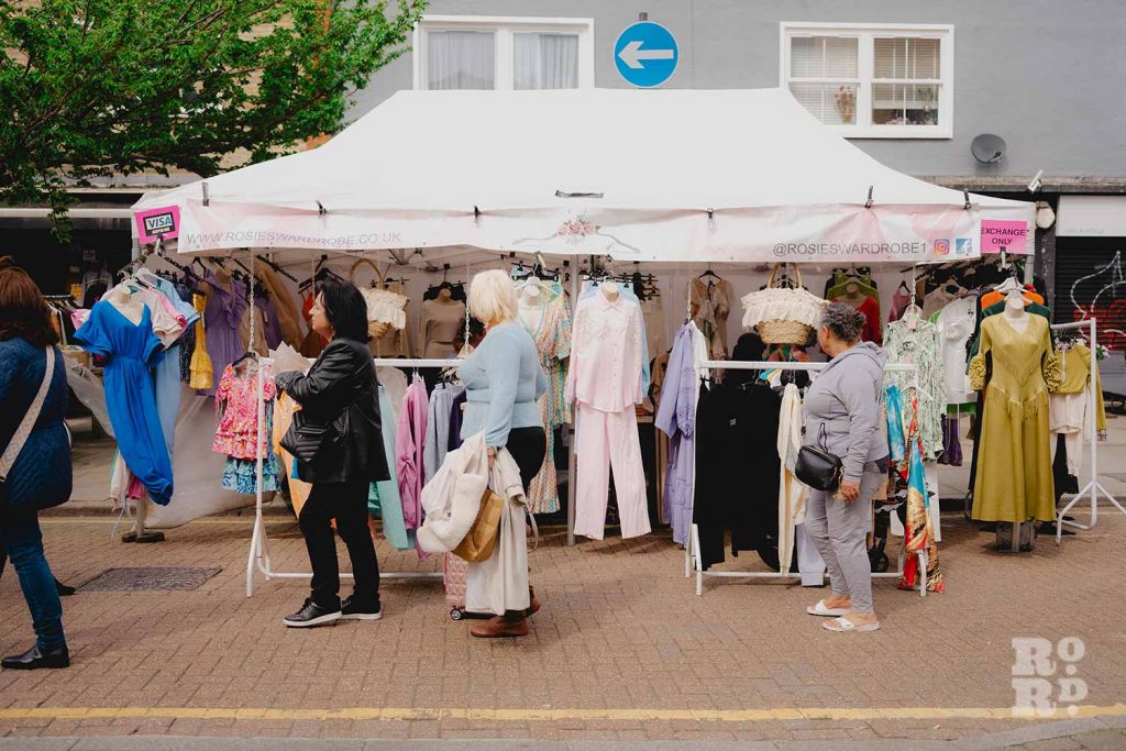 Rosie Smyth's 'outdoor boutique' on Roman Road Market - a stall with a colourful range of summer dresses and blouses