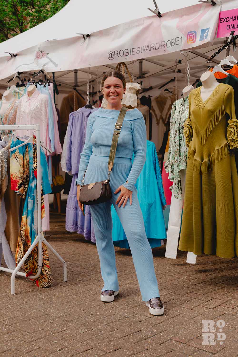 Roman Road Market trader Rosie Smyth standing outside her ladies fashion stall