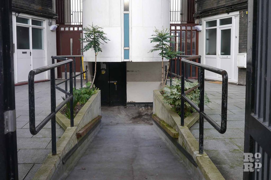 Hidden access door on Sulkin House, Greenways council estate, Globe Town, East London.