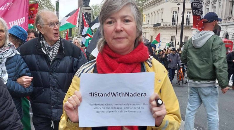 Queen Mary of London University professor with a sign saying #IStandWithNadera
