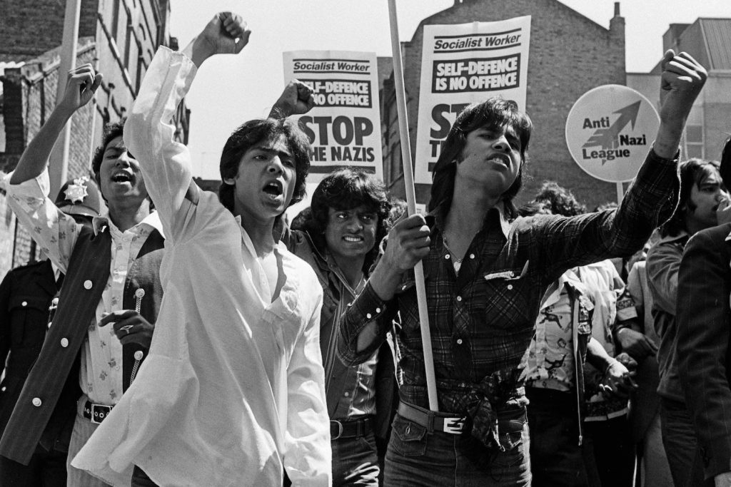Young Bengali men demonstrating on Brick Lane againsts the Nazi League in the 1970s.