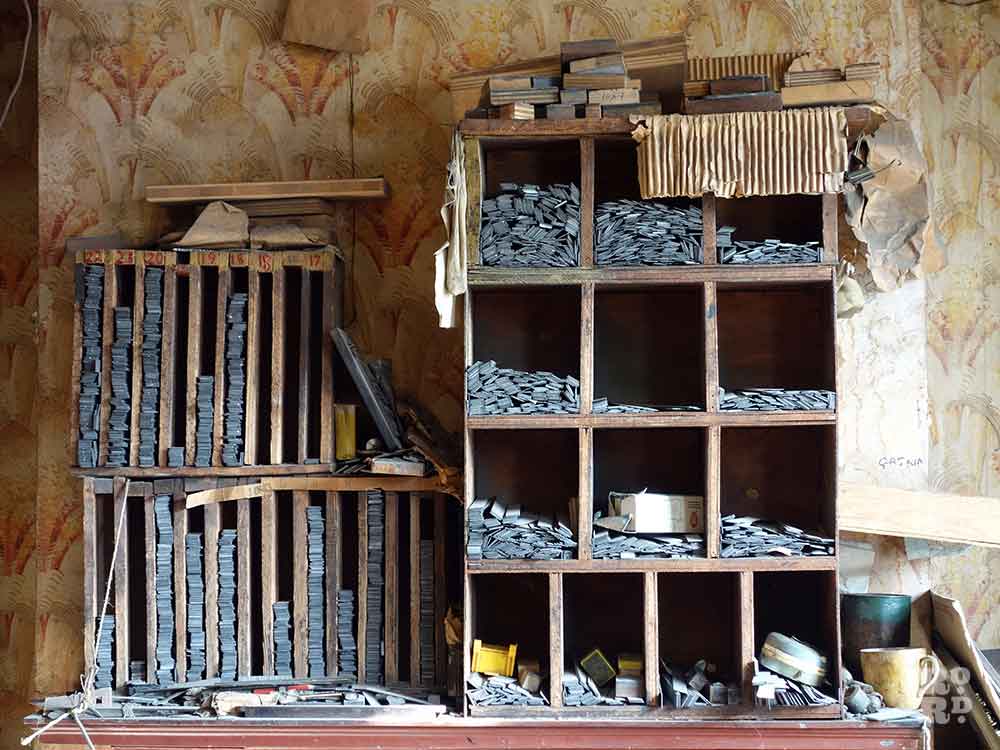 Pigeon hole cabinets filled with leads and type faces at Arbers stationary shop on Roman Road, Bow, East London.