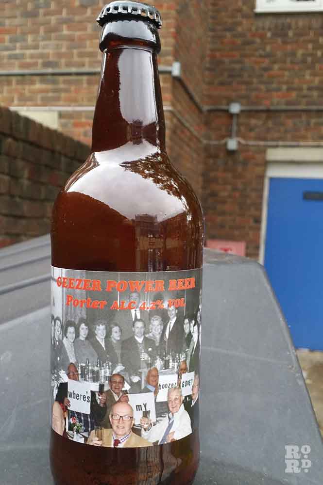 Bottle of beer with the Geezer Power Beer label.