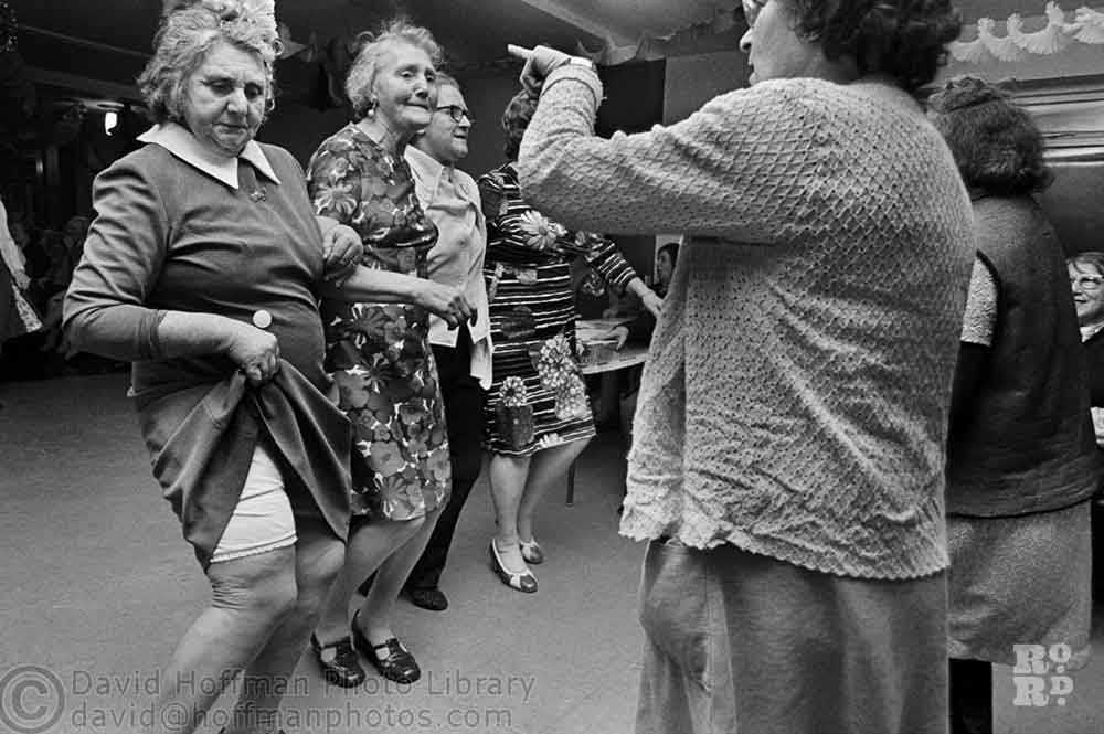 Black and white photograph of East End women dancing.